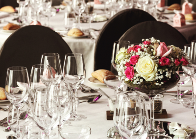 table at a wedding reception in black with flowers