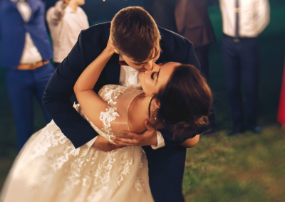 wedding couple dipping and kissing