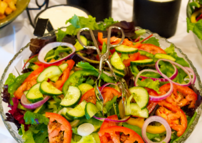 salad on a plate with carrots onions and peppers