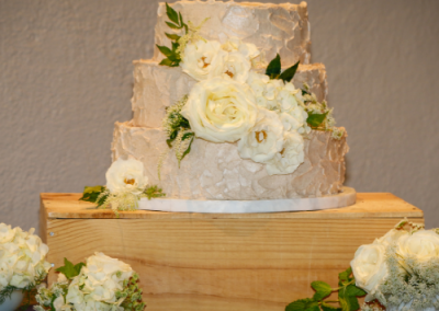 white wedding cake with white roses 3 tier