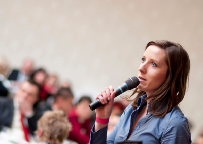 girl giving a presentation to a group of people